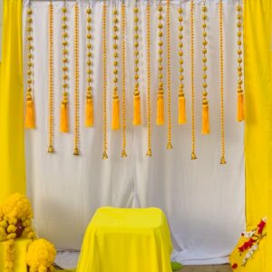 Yellow Pom pom hangings +Backdrop curtains stage decor