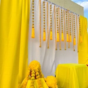 Yellow Pom pom hangings +Backdrop curtains stage decor